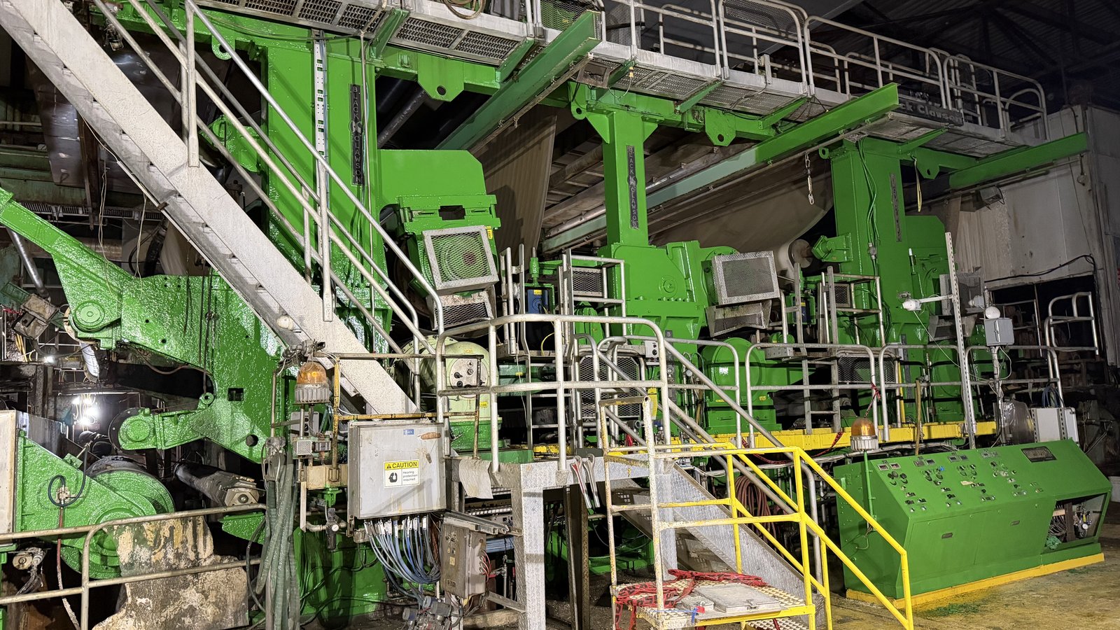 Freshly repainted green paper machine after industrial painting